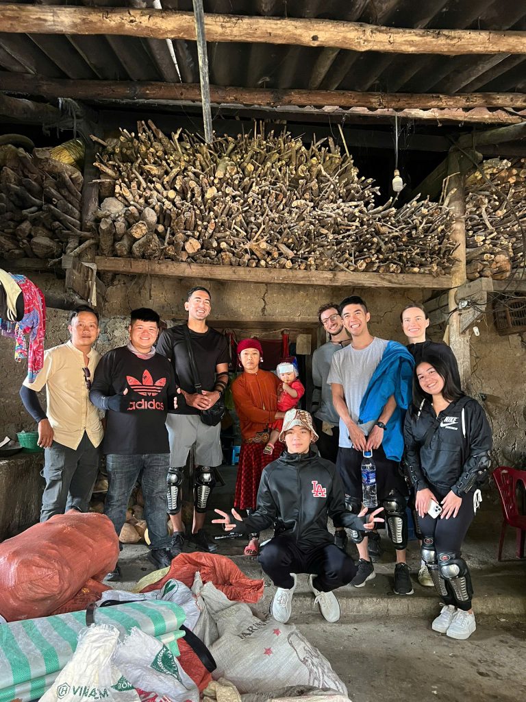 Friendly BiBi guides with happy visitors during Ha Giang Loop Tour.