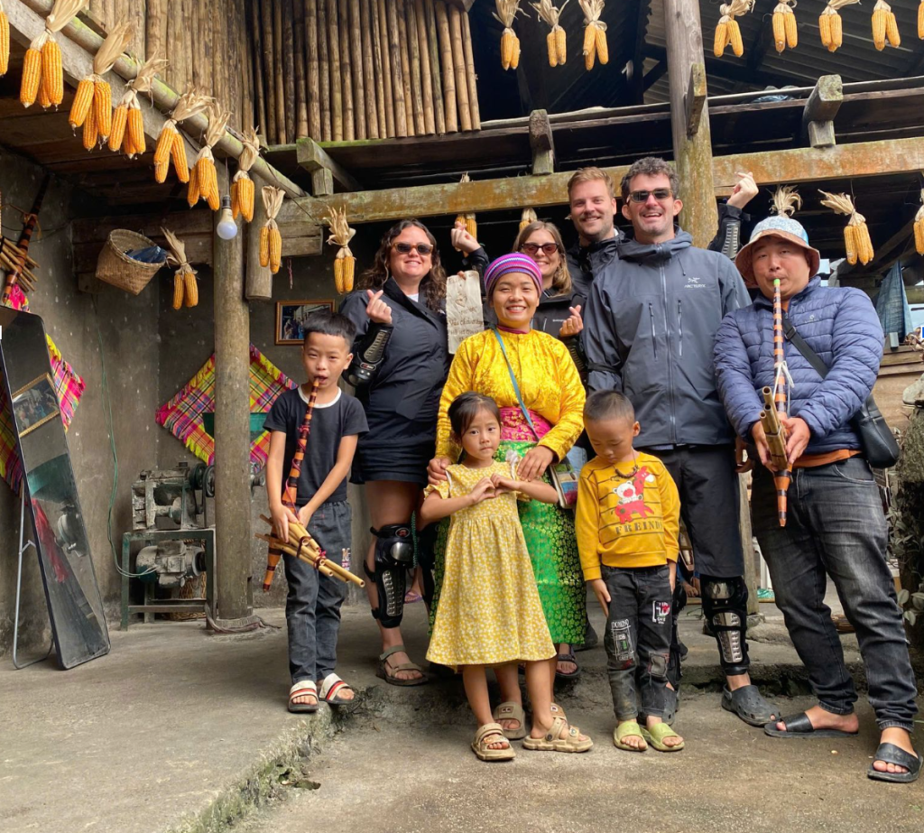 BiBi Ha Giang Loop Tour guests and ethnic people during Ha Giang Loop Tour trip.